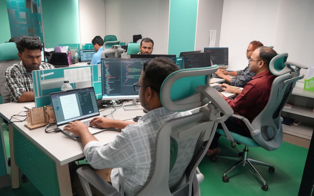Engineers working together at their desks in Girmairi's offshore development office in Dhaka, Bangladesh