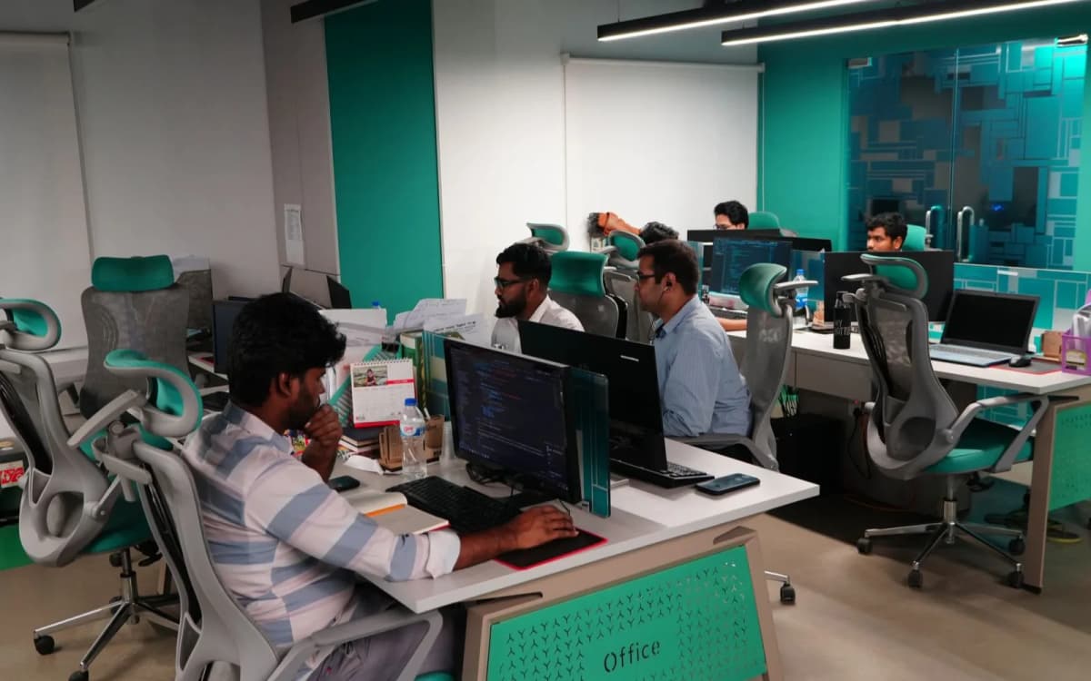 Girmairi offshore development team working late at their desks in the Dhaka office