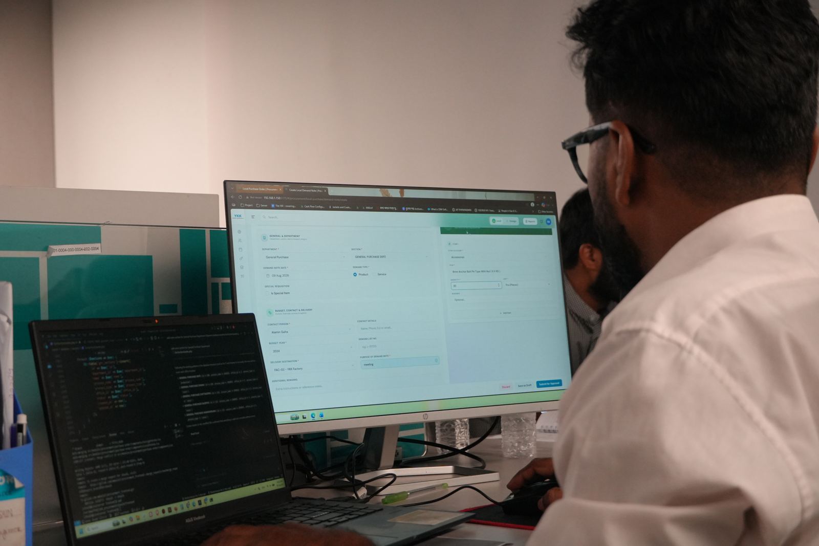 An engineer coding at Girmairi