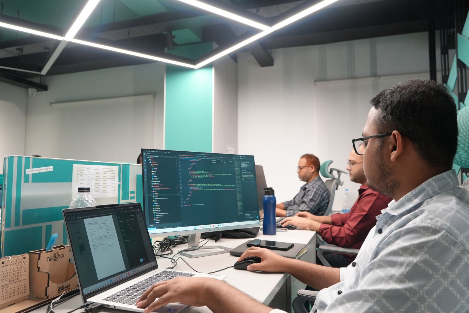 An engineer reviewing code at Girmairi